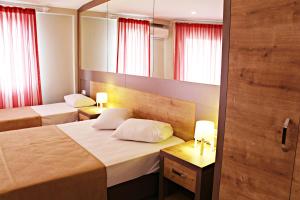 Ein Bett oder Betten in einem Zimmer der Unterkunft Ferah Hotel