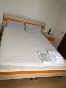 Postel nebo postele na pokoji v ubytování Orange Home Hotel