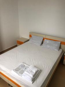 Postel nebo postele na pokoji v ubytování Orange Home Hotel