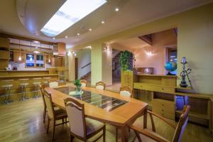 a dining room with a table and chairs at Villa Family Lienka in Liptovský Mikuláš