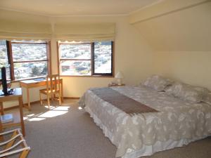 Un pat sau paturi într-o cameră la Hotel Seminario
