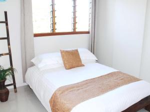 Postel nebo postele na pokoji v ubytování Vanuatu Beachfront Apartments