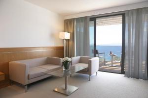 a living room with a couch and a table at ON'LIVE HOTEL in Çeşme