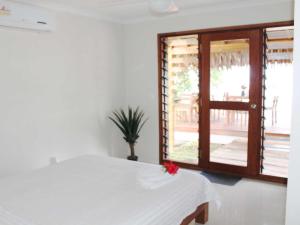 Postel nebo postele na pokoji v ubytování Vanuatu Beachfront Apartments