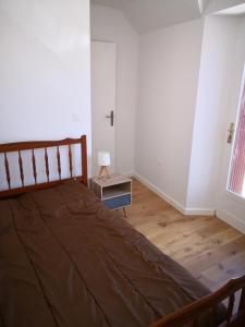 A bed or beds in a room at Appartement Rue Haute des Bains