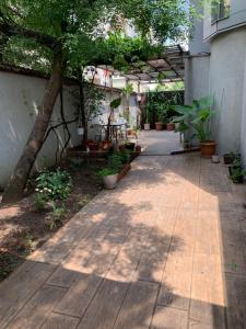 A garden outside Lilia 4 Self-Check in apartment