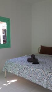 Postel nebo postele na pokoji v ubytování Wayang BnB