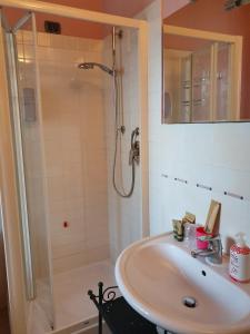 a bathroom with a sink and a shower at B&B Land & Sea in Campofilone