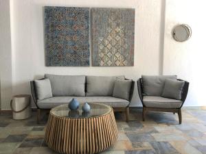 a living room with a couch and a table at Villa Spartias in Skiathos