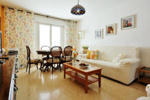 a living room with a couch and a table at TorreNueva in Zaragoza