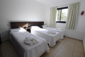 Una cama o camas en una habitación de Hotel La Colina del Sol