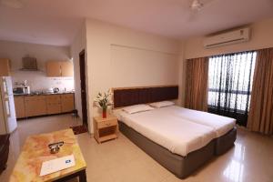 Lova arba lovos apgyvendinimo įstaigoje Landmark Suites Bollywood design Hotel