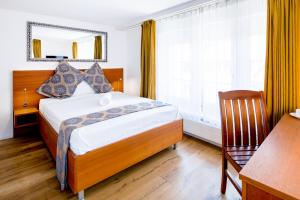 Posteľ alebo postele v izbe v ubytovaní Hotel Old Town