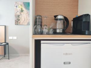 Kuchyň nebo kuchyňský kout v ubytování Luxury Suites by Notaly Ariel