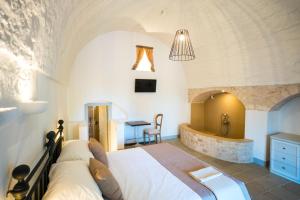 Postel nebo postele na pokoji v ubytování Borgo Cozzana