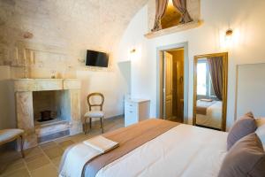 Postel nebo postele na pokoji v ubytování Borgo Cozzana