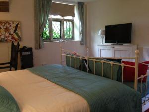 מיטה או מיטות בחדר ב-Riber Hall