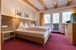 Postel nebo postele na pokoji v ubytování Hotel Sonnenheim