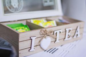 a wooden box with the word ihtm on it at Comfort Mitropoleos Apartment in Thessaloniki