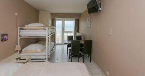 Postel nebo postele na pokoji v ubytování Hotel De Zeebries