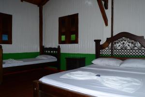 Postelja oz. postelje v sobi nastanitve Finca Hotel Villa Soledad
