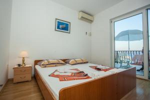 Posteľ alebo postele v izbe v ubytovaní Apartments Pušić + 37 fotografií