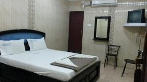 Posteľ alebo postele v izbe v ubytovaní Hotel Prakash