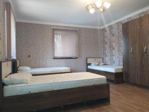 Postel nebo postele na pokoji v ubytování VM Hostel