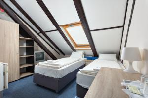Postel nebo postele na pokoji v ubytování Penzion Hotel Morrison