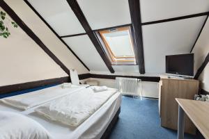 Postel nebo postele na pokoji v ubytování Penzion Hotel Morrison