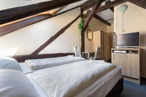 Postel nebo postele na pokoji v ubytování Penzion Hotel Morrison