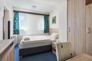 Postel nebo postele na pokoji v ubytování Penzion Hotel Morrison