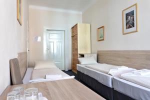 Postel nebo postele na pokoji v ubytování Penzion Hotel Morrison