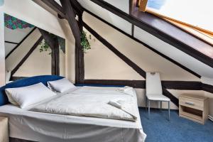 Postel nebo postele na pokoji v ubytování Penzion Hotel Morrison