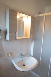 Koupelna v ubytování Vivo Hotel