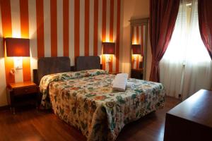 Posteľ alebo postele v izbe v ubytovaní Vivo Hotel