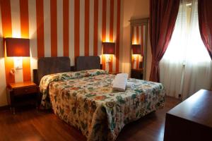 Postel nebo postele na pokoji v ubytování Vivo Hotel