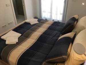 Łóżko lub łóżka w pokoju w obiekcie Mini Villa "Las Palmeras"