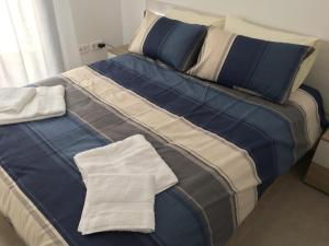 Łóżko lub łóżka w pokoju w obiekcie Mini Villa "Las Palmeras"