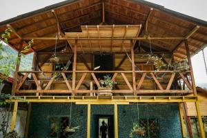 a large wooden house with a wooden ceiling at Creo Ecolodge Jardín in Jardin