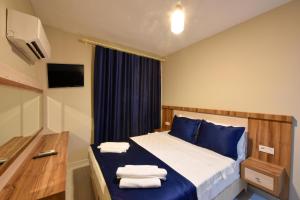 Postel nebo postele na pokoji v ubytování Lidya Hotel