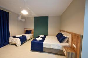 Postel nebo postele na pokoji v ubytování Lidya Hotel