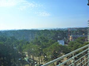 a view from the balcony of a resort with trees at Porta Mare Apartments LuxView in Dziwnówek