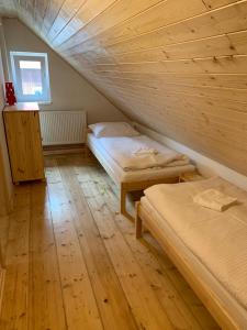 Postel nebo postele na pokoji v ubytování Apartmány Michaela