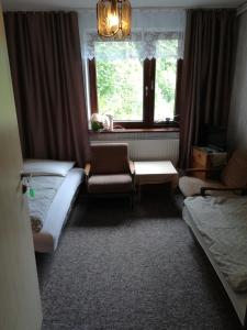 Una cama o camas en una habitación de Willa Katarzynka