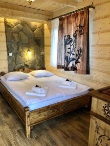 Posteľ alebo postele v izbe v ubytovaní Apartamenty Willa Szafran z widokiem na góry