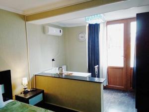a hotel room with a bathroom with a sink at Hotel Aragvi in Mtskheta
