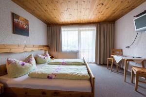 Letto o letti in una camera di Ferienpension Steiner