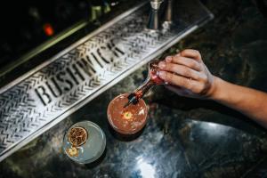 a person holding a spoon with a chocolate drink at Fabric Hotel - an Atlas Boutique Hotel in Tel Aviv