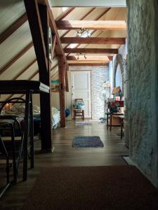 a room with a bed and a room with a ceiling at Riia 141 Apartment in Pärnu